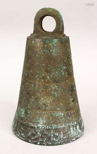 AN EARLY ISLAMIC BRONZE TEMPLE BELL/GONG, the lower section with carved calligraphy, 24cm high, 15cm