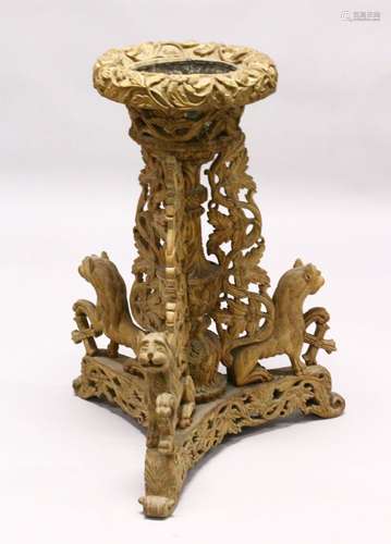 A 18TH / 19TH CENTURY INDIAN CARVED WOODEN JARDINIERE STAND, the stand carved with lions to the