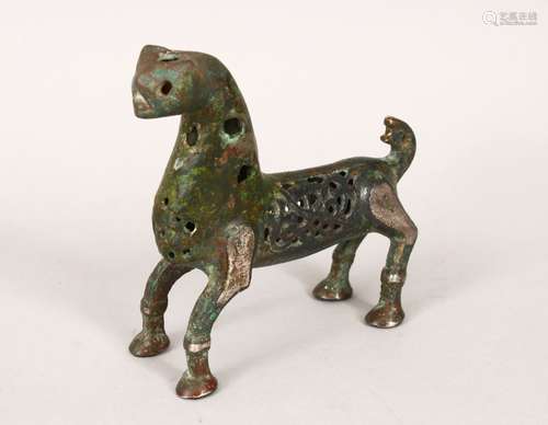 A 12TH/13TH CENTURY ISLAMIC SELJUK BRONZE LION, with openwork decoration, 11cm long, 10.5cm high.