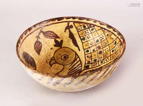 AN EARLY ISLAMIC CERAMIC BOWL WITH BIRD MOTIF, 20cm diameter.