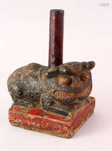 AN EARLY CHINESE / ASIAN POLY CHROME DECORATED CARVED STONE FIGURE OF A LION DOG, 20cm high x 15cm