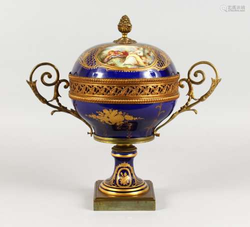 A SUPERB DARK BLUE GROUND SEVRES CIRCULAR TWO-HANDLED CENTREPIECE AND COVER, with rich gilt