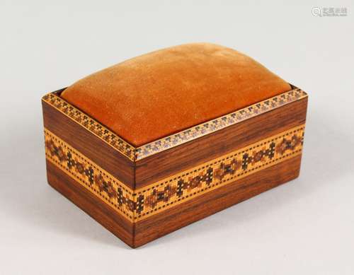 A TUNBRIDGE WARE RECTANGULAR PIN CUSHION, the sliding top padded with velvet. 5ins long.