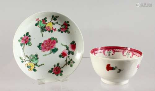 AN EARLY ENGLISH SAUCER, enamelled with fruit and flowers, and A FAMILLE ROSE TEA BOWL (2).
