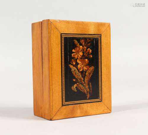 A TUNBRIDGE WARE BOX, the lift-off top with marquetry flower. 4ins long.