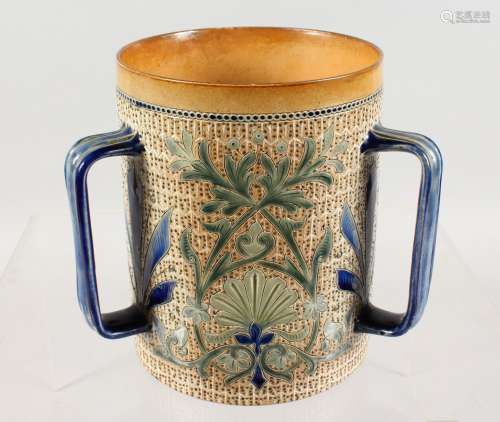 A DOULTON LAMBETH SALT GLAZED LOVING CUP, with incised stylised floral decoration, incised mark to