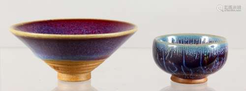 TWO SMALL CIRCULAR POTTERY DISHES, with high fired glazed decoration. 2ins x 3.5ins diameter.
