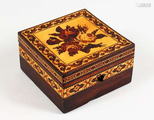 A TUNBRIDGE WARE MARQUETRY AND PARQUETRY SQUARE BOX, the hinged lid with a rose. 4ins square.