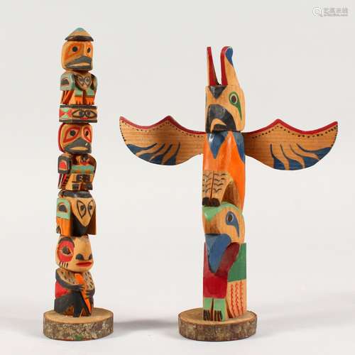 TWO COLOURFUL, PAINTED MINIATURE TOTEM POLES. 7ins high.