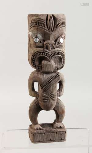 A MAORI TIKI CARVED WOOD FIGURE. 10ins high.