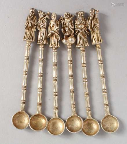 SIX CHINESE WHITE METAL FIGURAL SPOONS. 4ins long.