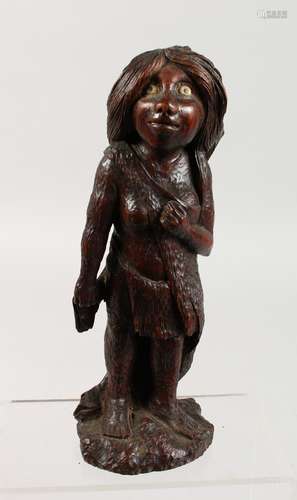 AN UNUSUAL CARVED HARDWOOD TRIBAL FEMALE FIGURE. 10ins high.