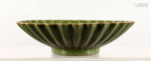 A CHINESE GREEN GROUND CRACKLE GLAZED DISH, of circular lobed form. 7.5ins diameter.