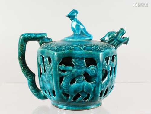 A CHINESE TURQUOISE GLAZED TEAPOT, with reticulated sides. 5ins high.