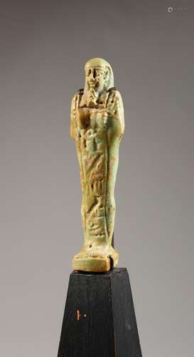 A SMALL EGYPTIAN USHABTI GLAZED POTTERY FIGURE, on later base. Figure: 4ins high.