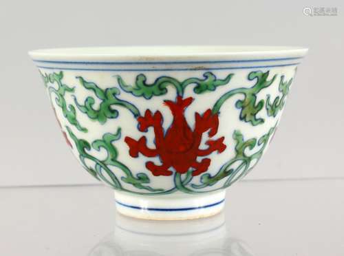 A CHINESE TEA BOWL. Six character mark. 3.25ins diameter.