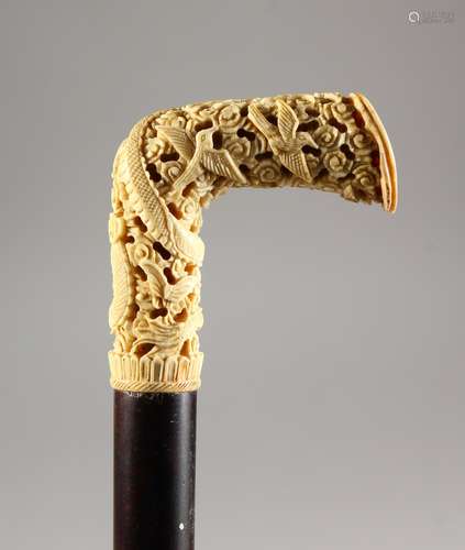 A GOOD LATE 19TH/EARLY 20TH CENTURY EBONY CANE WITH CARVED CANTON IVORY HANDLE. 36ins long.