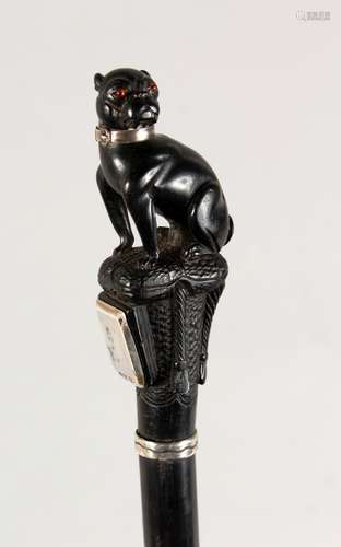 A VERY GOOD EBONY CANE, EARLY 20TH CENTURY, the handle well carved as a pug dog seated on a cushion,