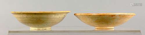 TWO EARLY CHINESE EARTHENWARE BOWLS.