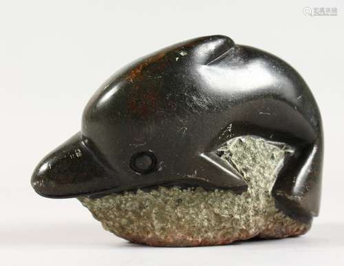 A CARVED MODEL OF A DOLPHIN. 4.5ins wide.