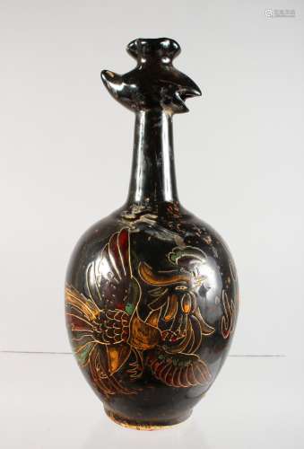 A CHINESE BLACK POTTERY JUG of bulbous shape with calligraphy. 11ins high.