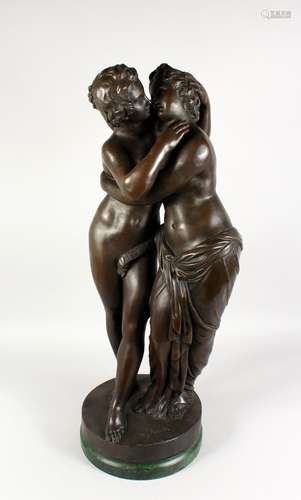 A LARGE BRONZE CLASSICAL GROUP, modelled as embracing lovers, on a circular marble base. 33ins