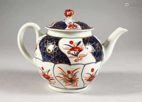 AN 18TH CENTURY WORCESTER TEAPOT AND COVER, painted with panels in Imari style.