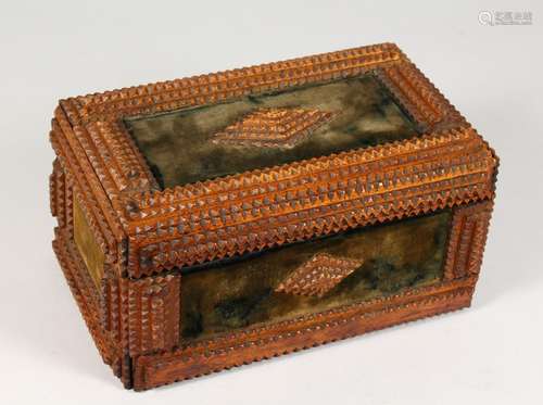 A 19TH CENTURY GEOMETRICALLY CARVED WOOD CASKET, with velvet lined panels. 11.5ins wide.