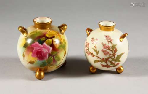 A ROYAL WORCESTER SPHERICAL TWO HANDLED VASE, on three feet painted with roses C.1912 and a