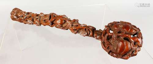 A CHINESE CARVED ROOTWOOD RUYI SCEPTRE. 14ins long.