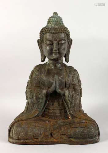 A LARGE CHINESE BRONZE FIGURE OF A SEATED BUDDHA. 17ins high.