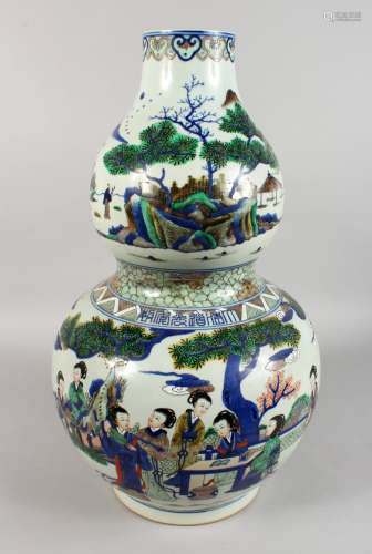A LARGE CHINESE PORCELAIN DOUBLE GOURD VASE, painted with figures seated at a table in a