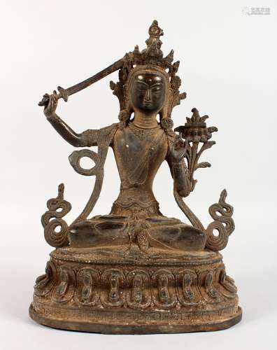 A CHINESE CAST BRONZE FIGURE OF A SEATED FEMALE DEITY, holding a sword in her right hand. 12ins