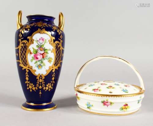 A MINTON TWO-HANDLED VASE, painted with flowers on a raised gilt and cobalt blue ground and a Minton