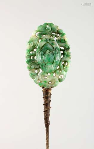 A CHINESE CARVED JADE HAIRPIN. 7ins long.