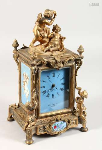 A FRENCH GILT BRONZE CLOCK, VINCENTI ROSE, the top with cupid, the sides painted porcelain panels.