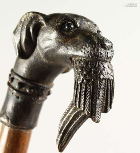 A CAST METAL DOG'S HEAD AND PHEASANT WALKING STICK. 2ft 9ins long.