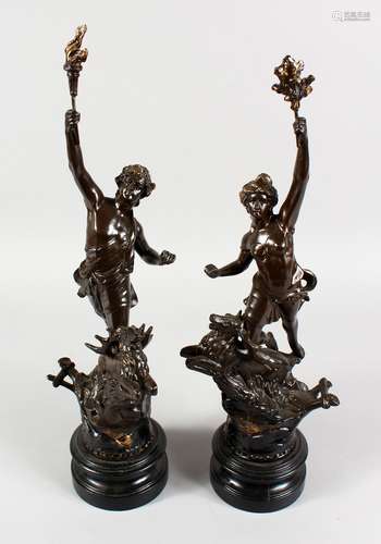 A PAIR OF CLASSICAL SPELTER FIGURES, on circular wooden bases. 18.5ins high.