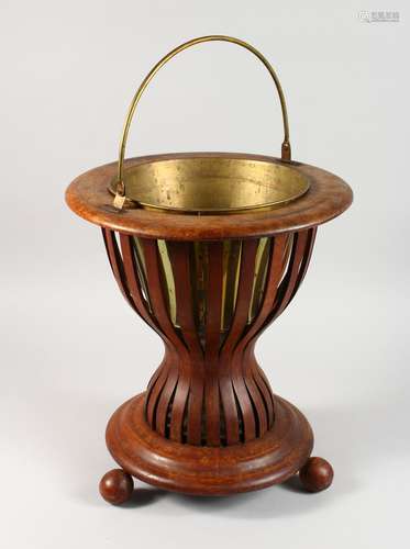 AN EARLY 20TH CENTURY DUTCH MAHOGANY JARDINIERE, with brass liner and handle. 1ft 4ins high.