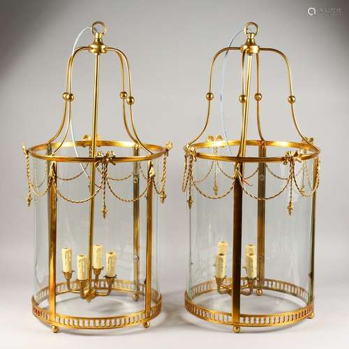 A LARGE PAIR OF GEORGE III STYLE BRASS CIRCULAR HALL LANTERNS. 2ft 8ins high.