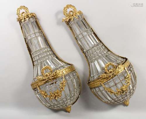 A PAIR OF BRASS AND CUT GLASS CHANDELIER STYLE WALL LIGHTS. 28ins high.