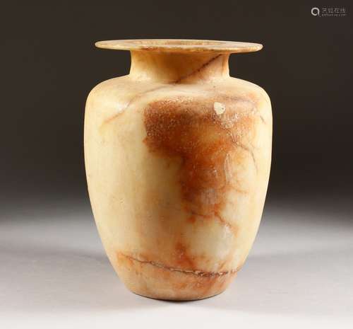 AN EGYPTIAN ALABASTER CANOPIC STYLE JAR. 11ins high.