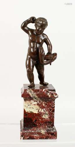 A GOOD SMALL BRONZE, possibly 17th century, depicting a young man wrestling a serpent, mounted on