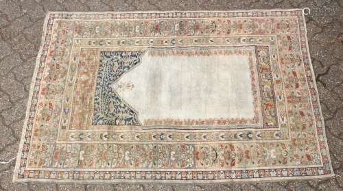 A GOOD EARLY 20TH CENTURY OTTOMAN PRAYER RUG, retailed by Omar of Harrogate. 5ft 8ins x 3ft 11ins.