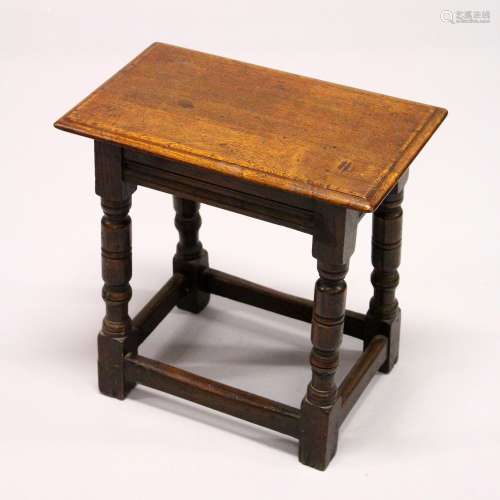 A 17TH CENTURY STYLE OAK JOINT STOOL, with rectangular top, plain frieze on stretchered, turned