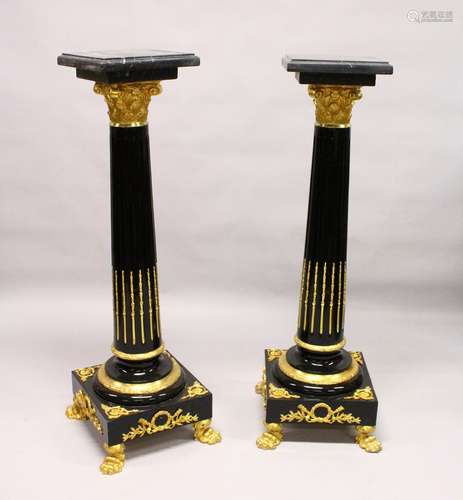 A PAIR OF IMPRESSIVE REGENCY STYLE EBONISED AND ORMOLU MOUNTED CORINTHIAN COLUMNS, with black marble