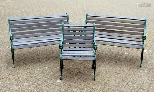 A PAIR OF VICTORIAN STYLE GARDEN BENCHES, each with ornate cast metal ends and wooden slats;