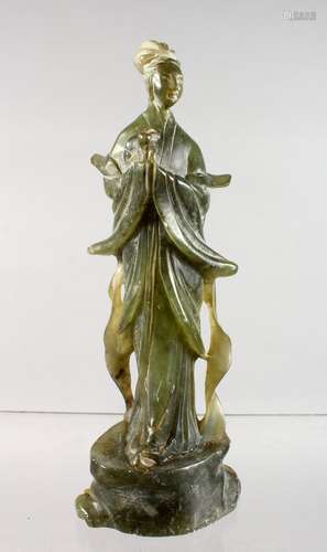 A CARVED SOAPSTONE FIGURE OF GUANYIN.