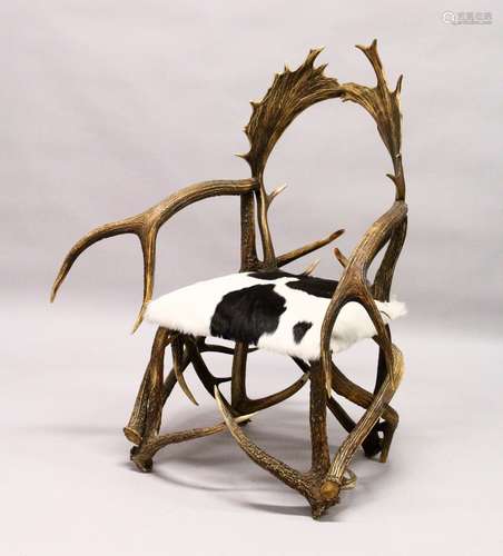 A GOOD GROTTO OR HUNTING LODGE ARMCHAIR, 20TH CENTURY, the frame constructed from deer antlers,