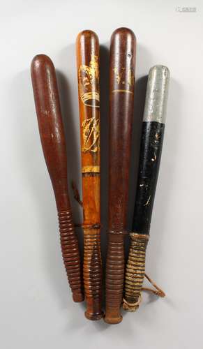 TWO VICTORIAN TRUNCHEONS, and two others. (4) 15.5ins - 18.5ins long.